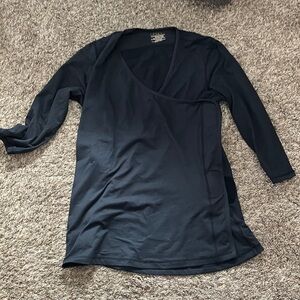 Nuroo baby wearing 3/4 length sleeve shirt